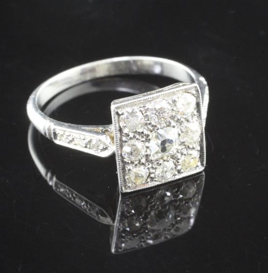 An early 20th century white gold and diamond cluster tablet ring, size K.